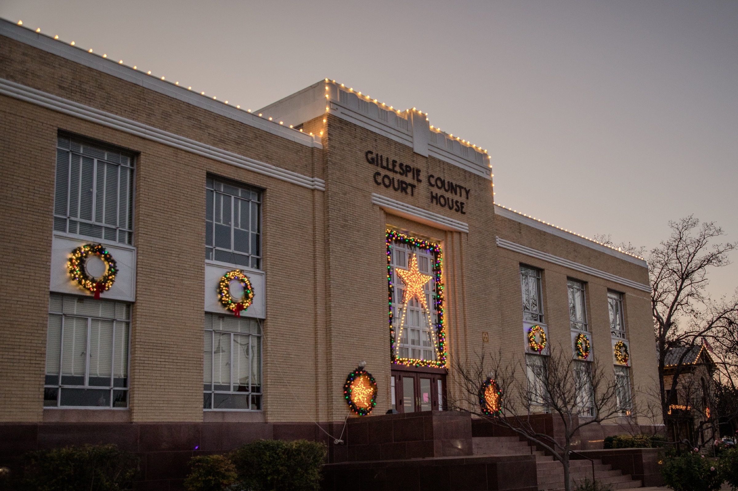 Architecture - Gillespie County Courthouse with holiday lights at dusk