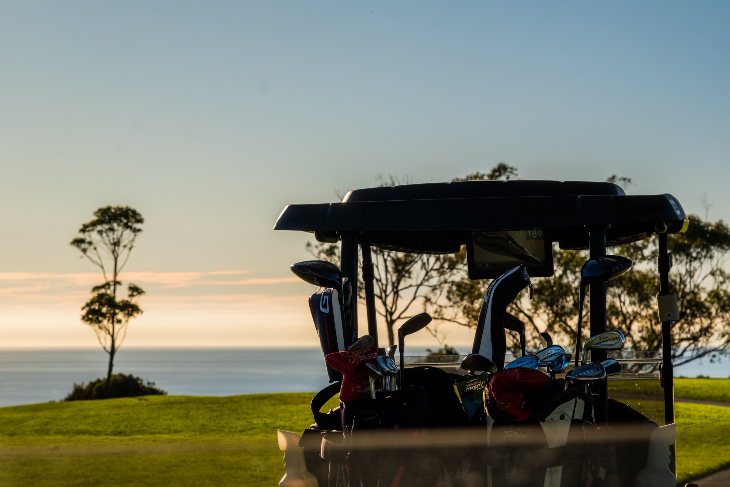 Golf cart at sunrise