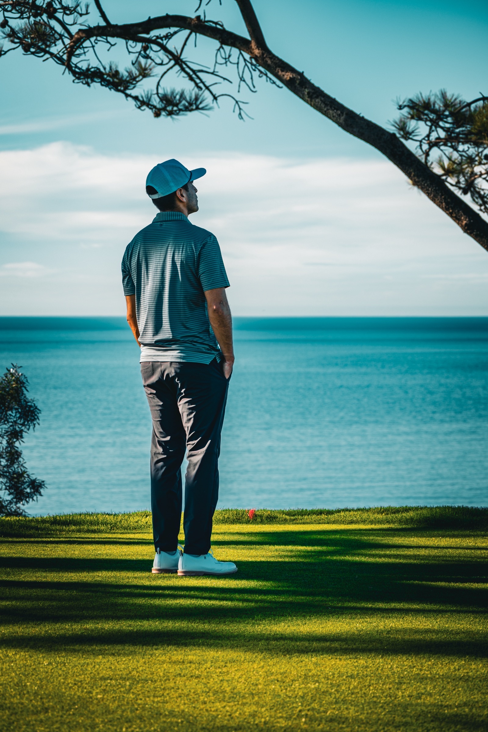 Golfer overlooking ocean